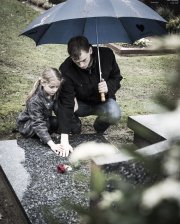 Father and daughter at graveside