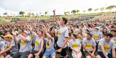 RootOne Teens in a crowd cheering