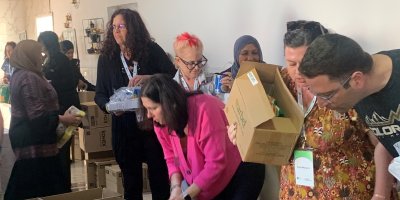 A group of people packing boxes