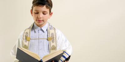 A boy studyiing Torah
