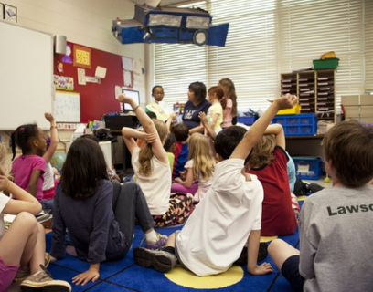 Children sit in a classroom