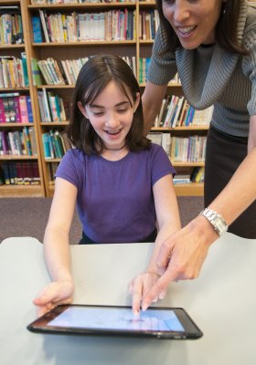 Teacher and student with technology