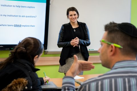 Rebecca Ruberg of The Jewish Education Project presents during The Jewish Education Project's Annual Yeshiva Day School Day of Learning.