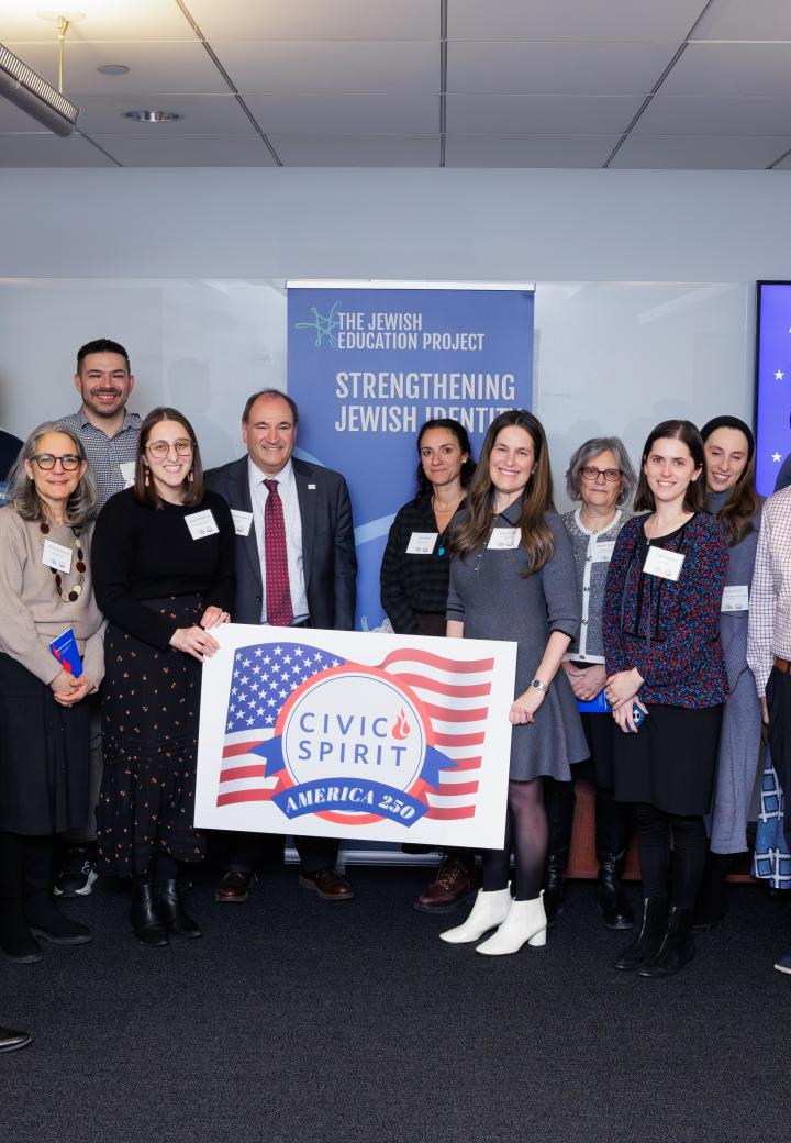 A group photo holding a sign that says Civic Spirit