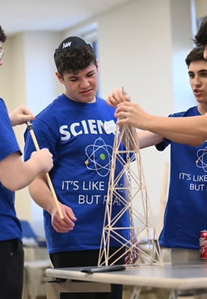 Four yeshiva boys work on a science project
