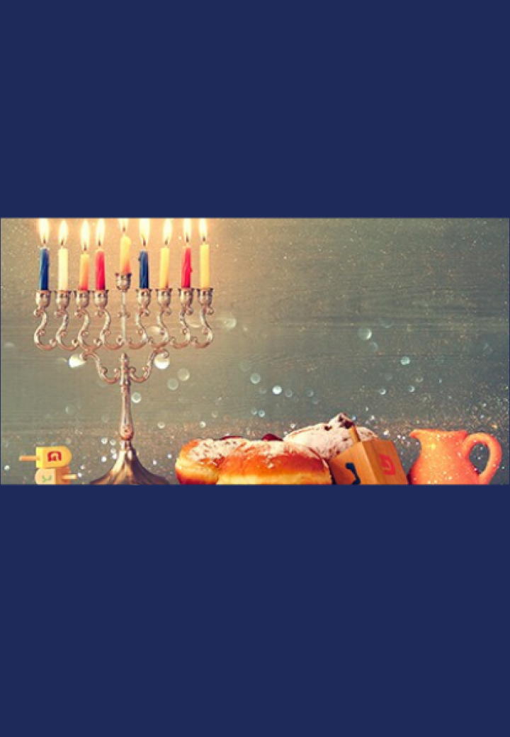 a menorah with sufganyiot and a dreidel