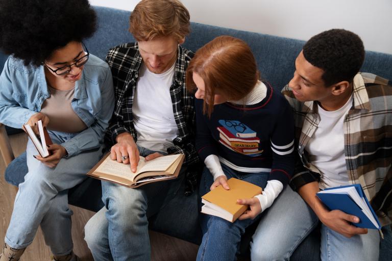 teens looking at books