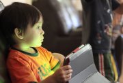 Child playing with a tablet